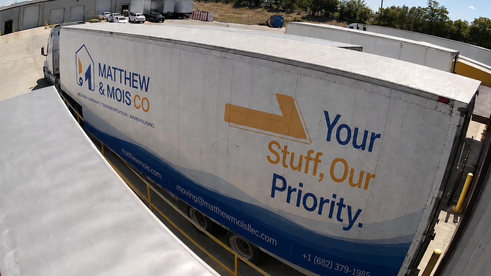 A branded Matthew and Mois semi-trailer backed into the loading dock at the company warehouse in Alvarado, Texas